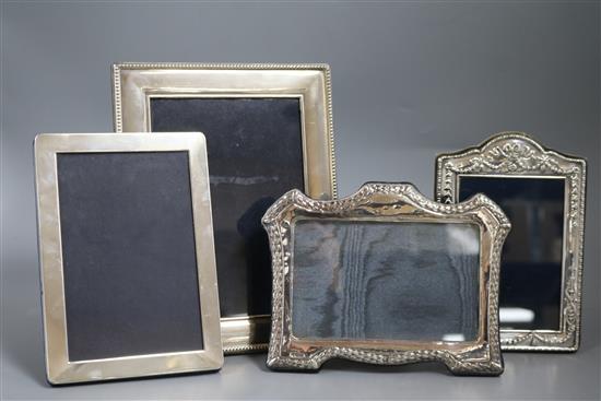 Four assorted modern silver mounted photograph frames including Harrods Ltd, largest 22.5cm.